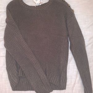 a cute top with buttons on the side